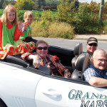 Grand Marshall Carol Chandler rides with her grandchildren, Natalie and Anthony, in the Montross Fall Festival Parade. Source: Westmoreland News