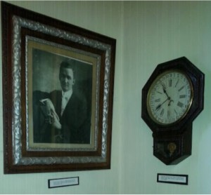 Portrait of Rev. Theodore G. Laughan, Minister when the Church was built in 1913, under whose leadership the present church was built in 1913.  Also pictured, Clock that was given to the Church by Tappahannock Building Supply, where materials to build the Church were obtained.